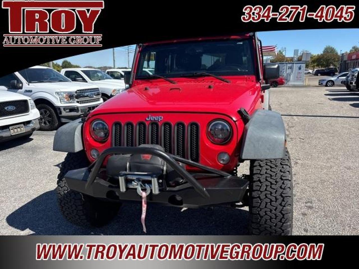 2015 Firecracker Red Clear Coat /Black Jeep Wrangler Unlimited Sport (1C4BJWDG8FL) with an 3.6L V6 24V VVT engine, Automatic transmission, located at 6812 Atlanta Hwy, Montgomery, AL, 36117, (334) 271-4045, 32.382118, -86.178673 - Photo#4