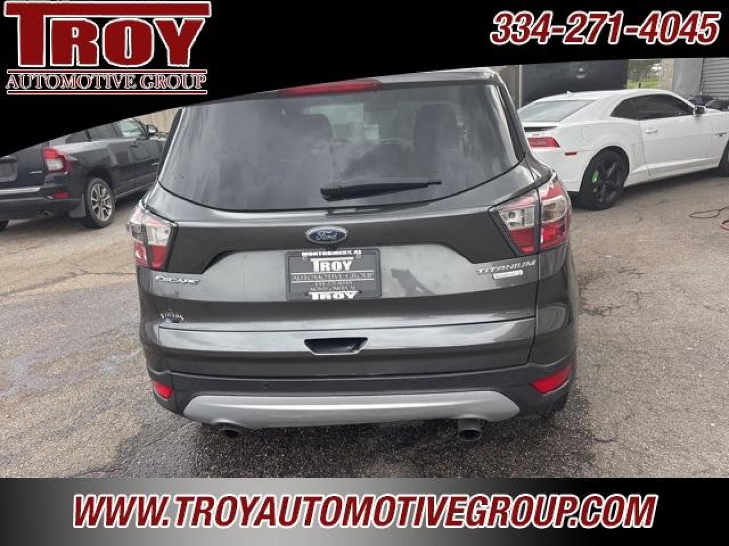 2017 Magnetic /Medium Light Stone Ford Escape Titanium (1FMCU0JD9HU) with an 1.5L EcoBoost engine, Automatic transmission, located at 6812 Atlanta Hwy, Montgomery, AL, 36117, (334) 271-4045, 32.382118, -86.178673 - Photo#9
