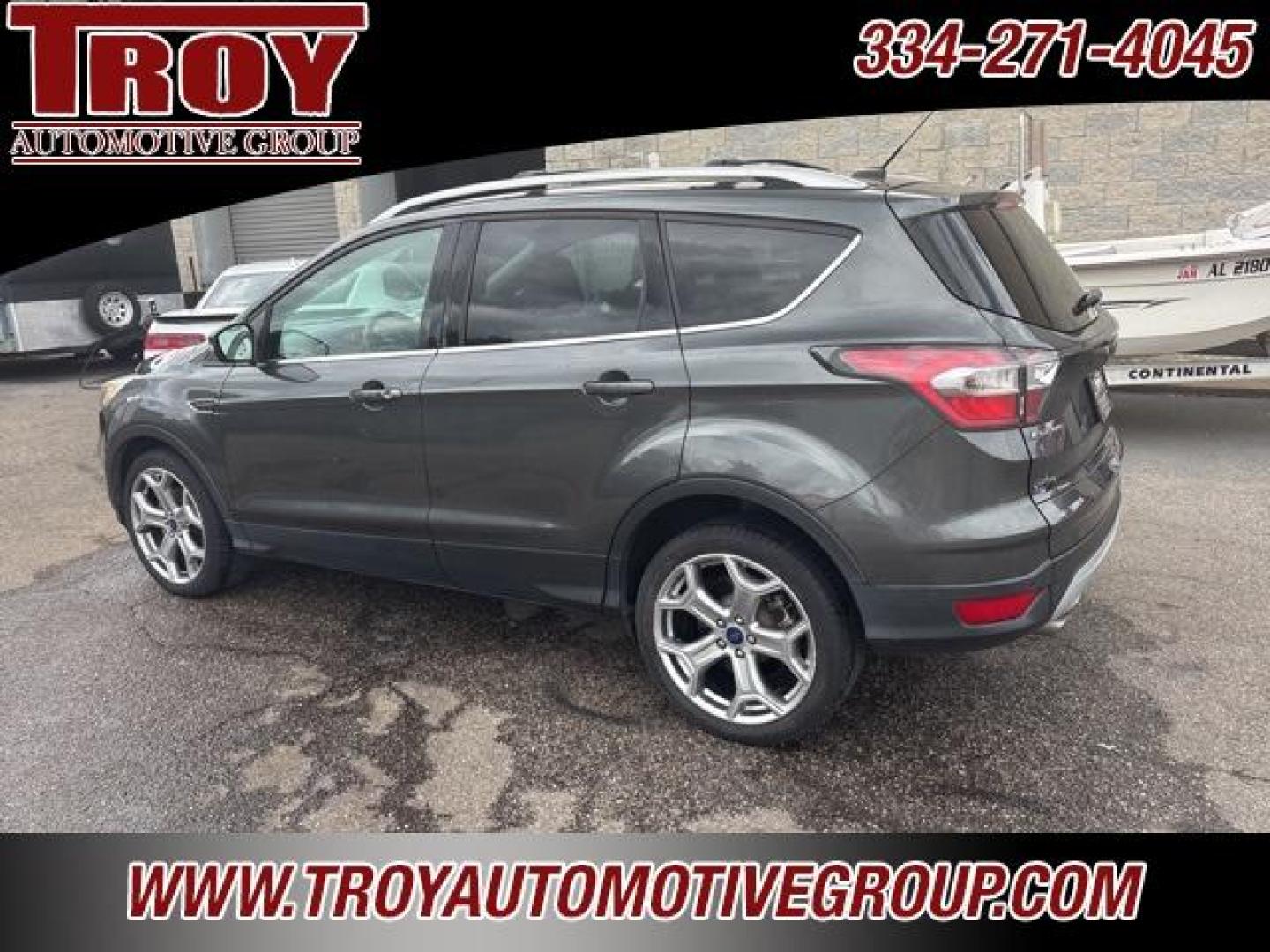 2017 Magnetic /Medium Light Stone Ford Escape Titanium (1FMCU0JD9HU) with an 1.5L EcoBoost engine, Automatic transmission, located at 6812 Atlanta Hwy, Montgomery, AL, 36117, (334) 271-4045, 32.382118, -86.178673 - Photo#11
