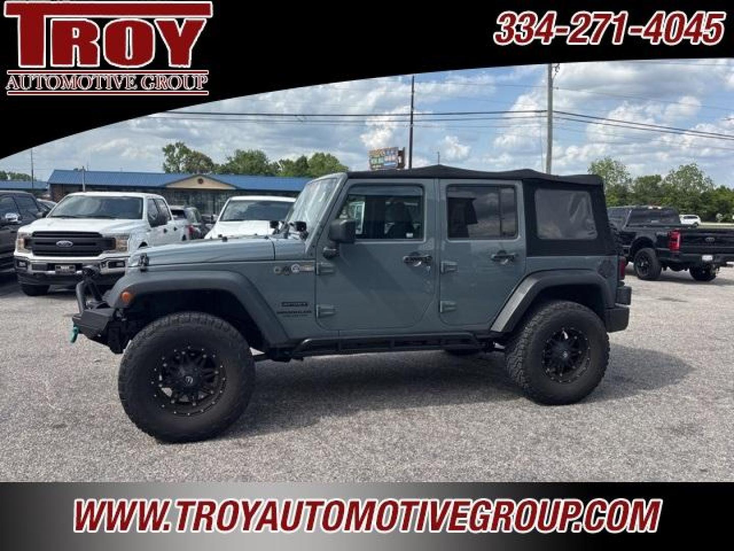 2014 Anvil Clear Coat /Black Jeep Wrangler Unlimited Sport (1C4BJWDG1EL) with an 3.6L V6 24V VVT engine, Automatic transmission, located at 6812 Atlanta Hwy, Montgomery, AL, 36117, (334) 271-4045, 32.382118, -86.178673 - Photo#0