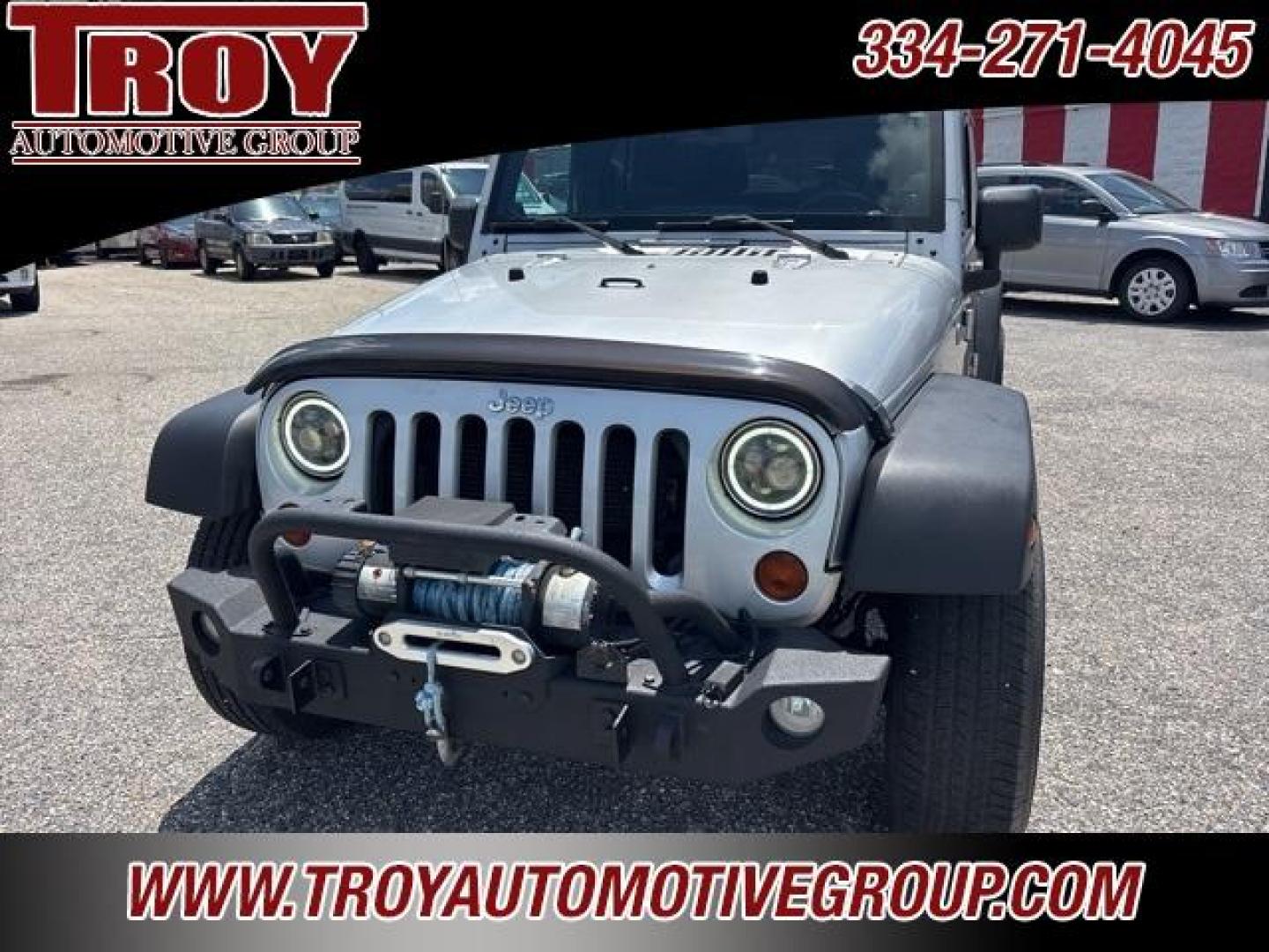 2012 Bright Silver Metallic Clearcoat /Black Interior Jeep Wrangler Unlimited Sport (1C4BJWDG9CL) with an 3.6L V6 24V VVT engine, Automatic transmission, located at 6812 Atlanta Hwy, Montgomery, AL, 36117, (334) 271-4045, 32.382118, -86.178673 - Winch!!<br>Tow Package!!<br>2-Master Remote Keys!!<br>Full Size Matching Spare!!<br>All Power Options!! - Photo#4