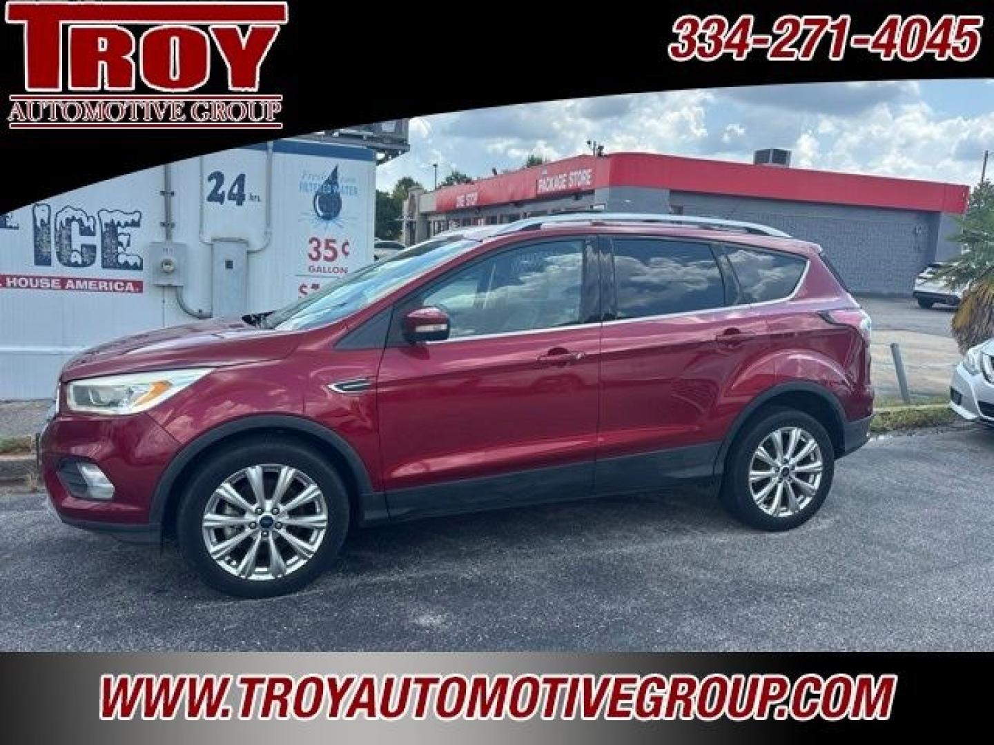 2017 Ruby Red Metallic /Black Ford Escape Titanium (1FMCU9J93HU) with an EcoBoost 2.0L I4 GTDi DOHC Turbocharged VCT engine, Automatic transmission, located at 6812 Atlanta Hwy, Montgomery, AL, 36117, (334) 271-4045, 32.382118, -86.178673 - Priced below KBB Fair Purchase Price!<br><br>Ruby Red Metallic 2017 Ford Escape Titanium 4WD EcoBoost 2.0L I4 GTDi DOHC Turbocharged VCT 6-Speed Automatic<br><br>Financing Available---Top Value for Trades.<br><br>Odometer is 18847 miles below market average! 20/27 City/Highway MPG<br><br><br>Awards:- Photo#0